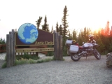 My motorcycle at the Arctic Circle at midnight.