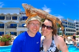 Ethan and Sarah with the Royal Playa del Carmen's pet iguana on their heads.