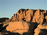 A rock formation in the Jumbo Rocks campground of Joshua Tree National Park at sunset.